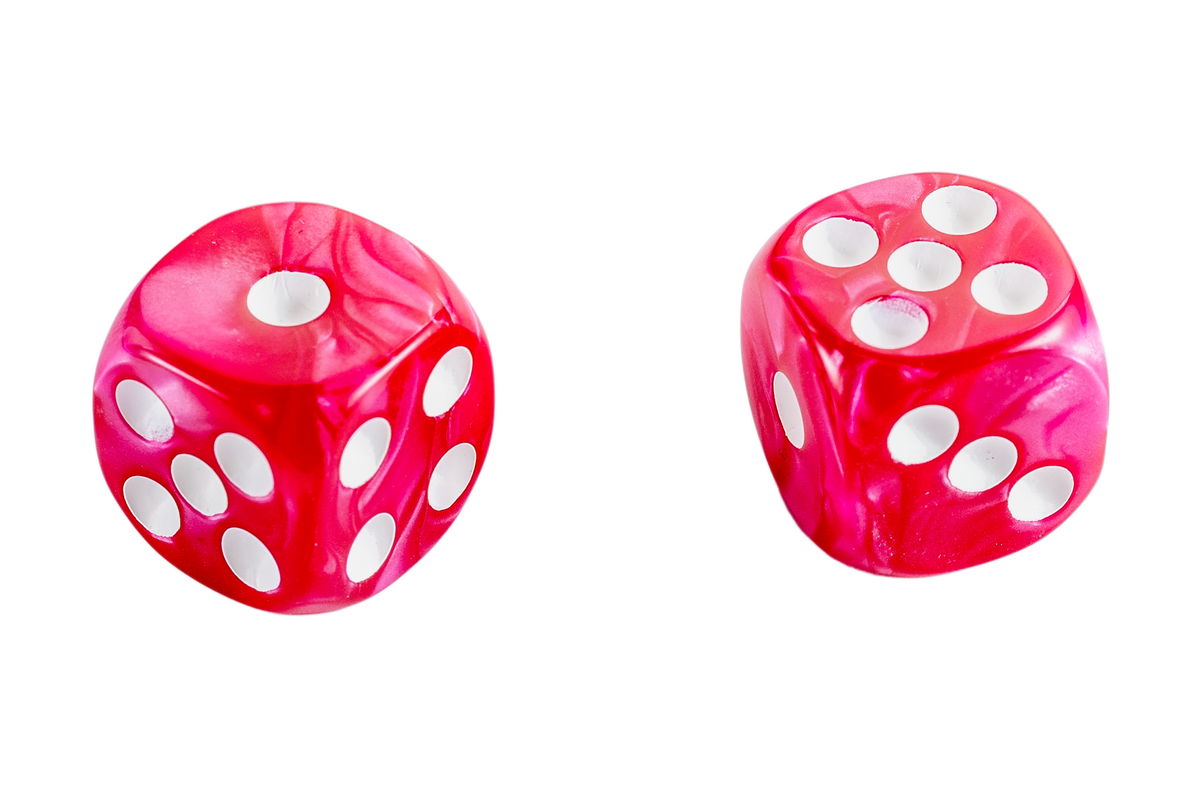 Two translucent Hot pink marbled dice with white pips, shown on a plain white background.