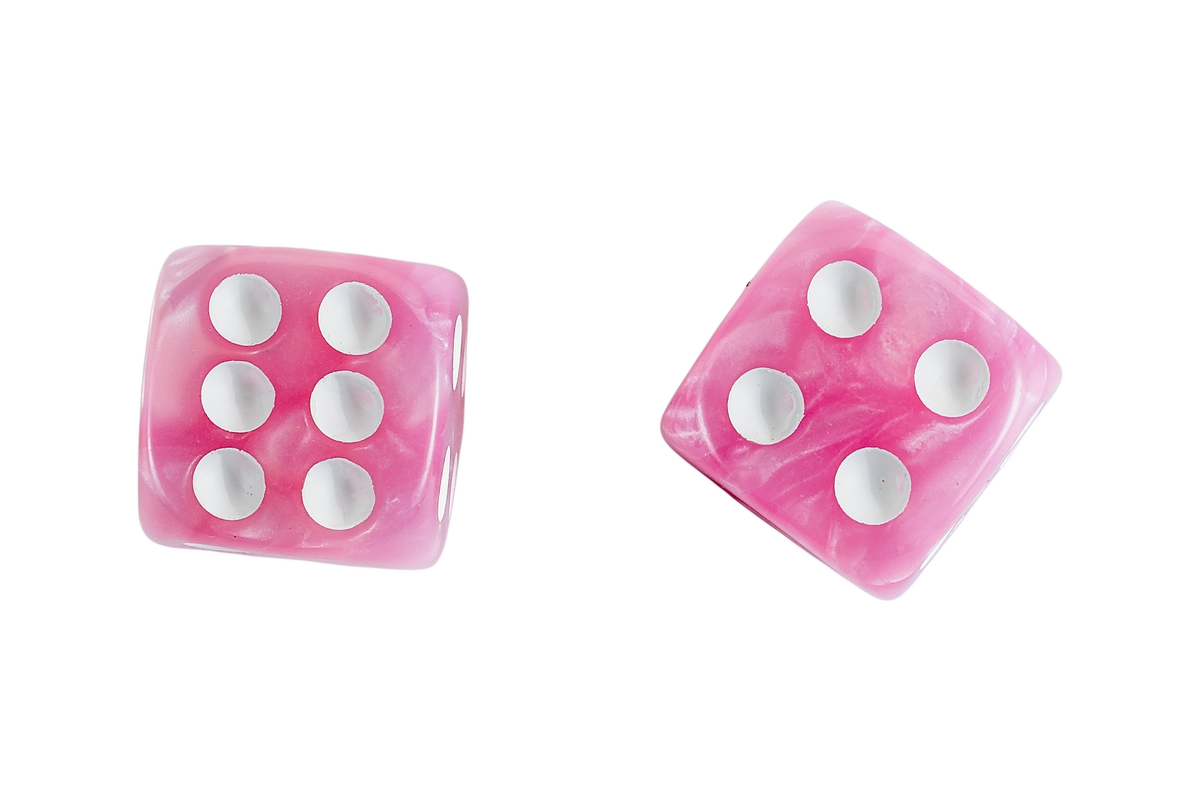 Two pink marbled acrylic dice on a solid white background, one showing a six and the other a four.